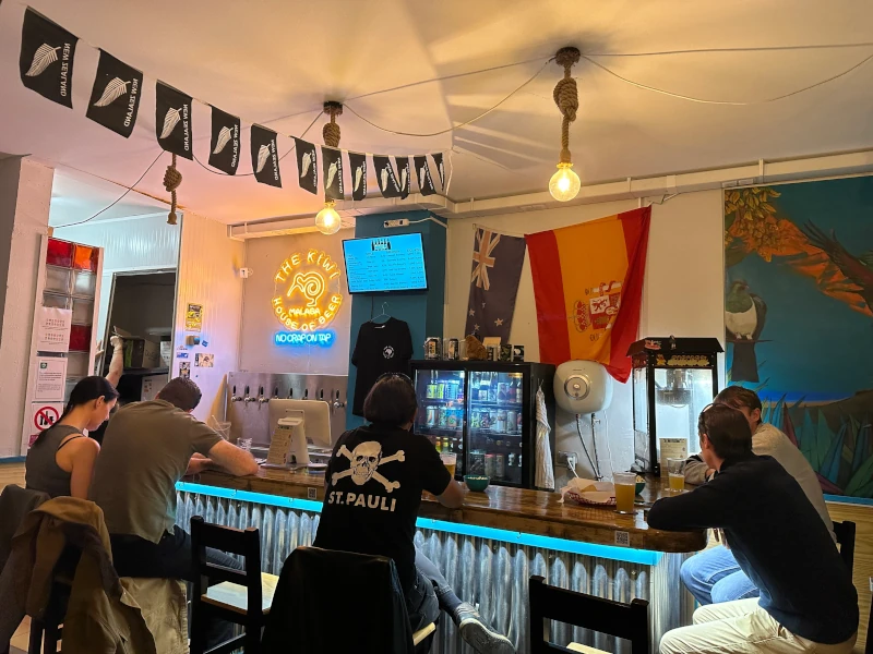 Bar interior at Kiwi House of Beer Málaga with taps and bottle selection
