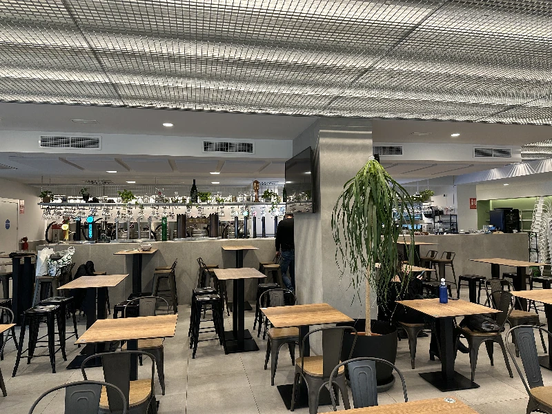 Bar interior at Cervecería Europa Internacional Seville with long tap list visible
